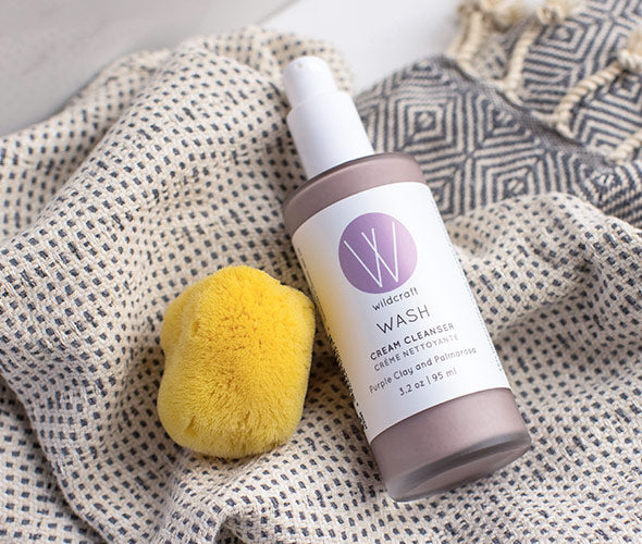 Silk Sea Sponge and Wash Cream Cleanser on a towel