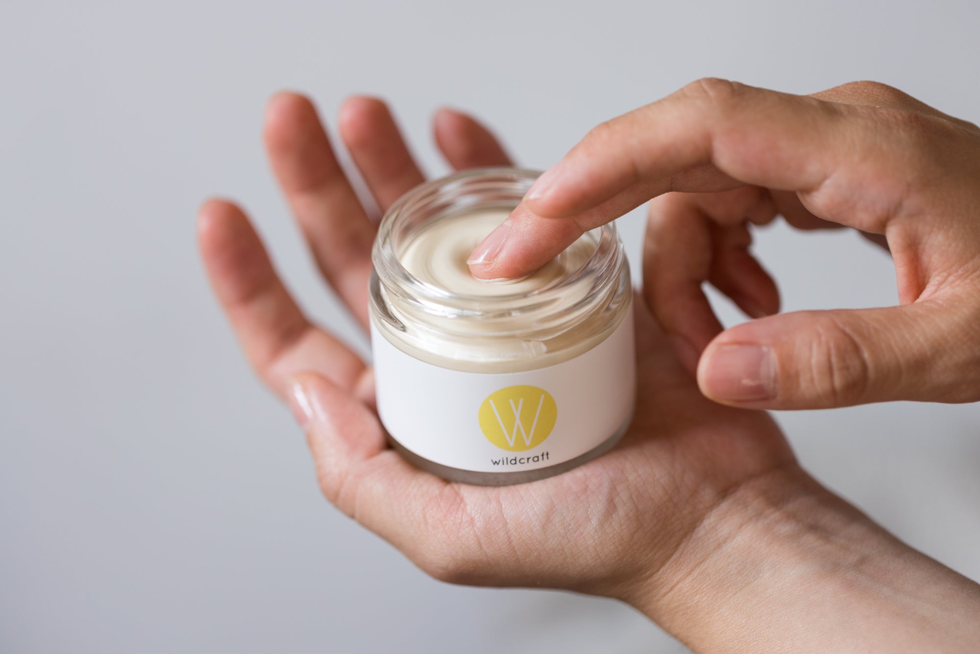 Hands holding Wildcraft's Lime and Bergamot Deodorant